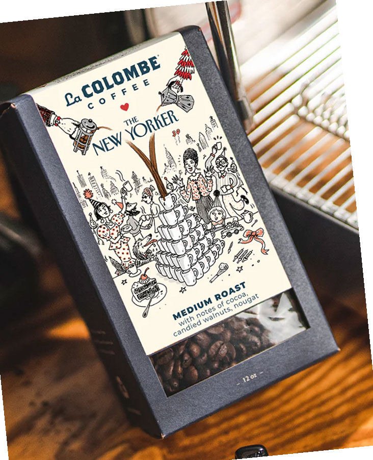 A slightly tilted product shot of a La Colombe Coffee "The New Yorker" medium roast, boasting cocoa, candied walnut, and nougat notes, with an illustrated label and visible coffee beans in a black box.